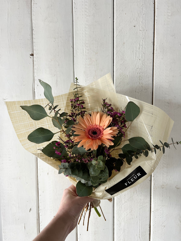 Cute seasonal flower bouquet with accompanying flowers and eucalyptus